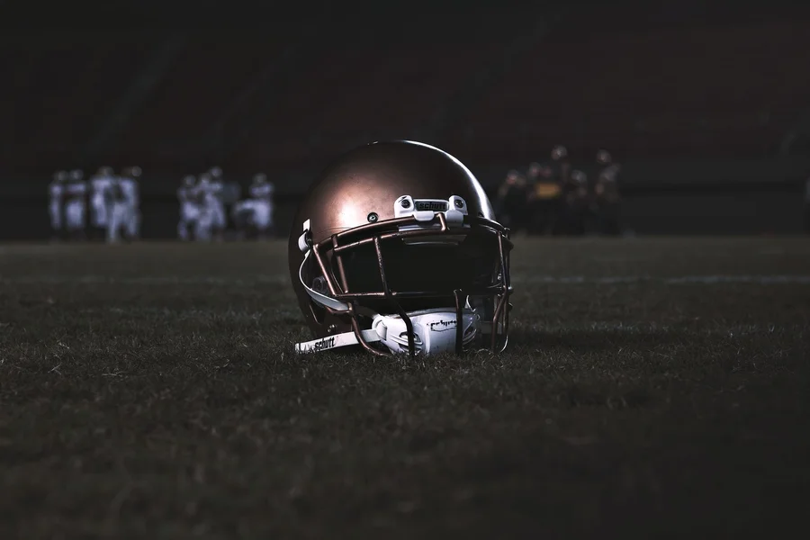 American football helmet on grass